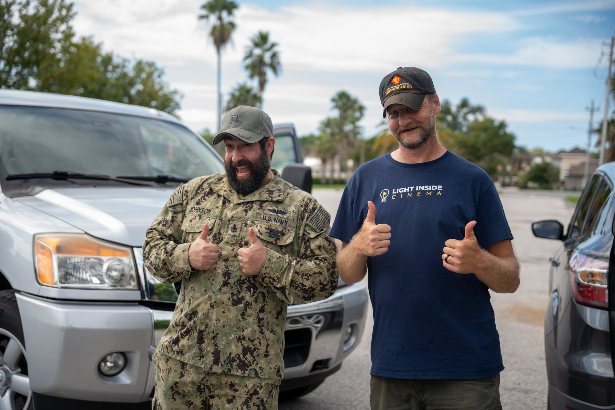 Luke Riether with a Navy veteran on set